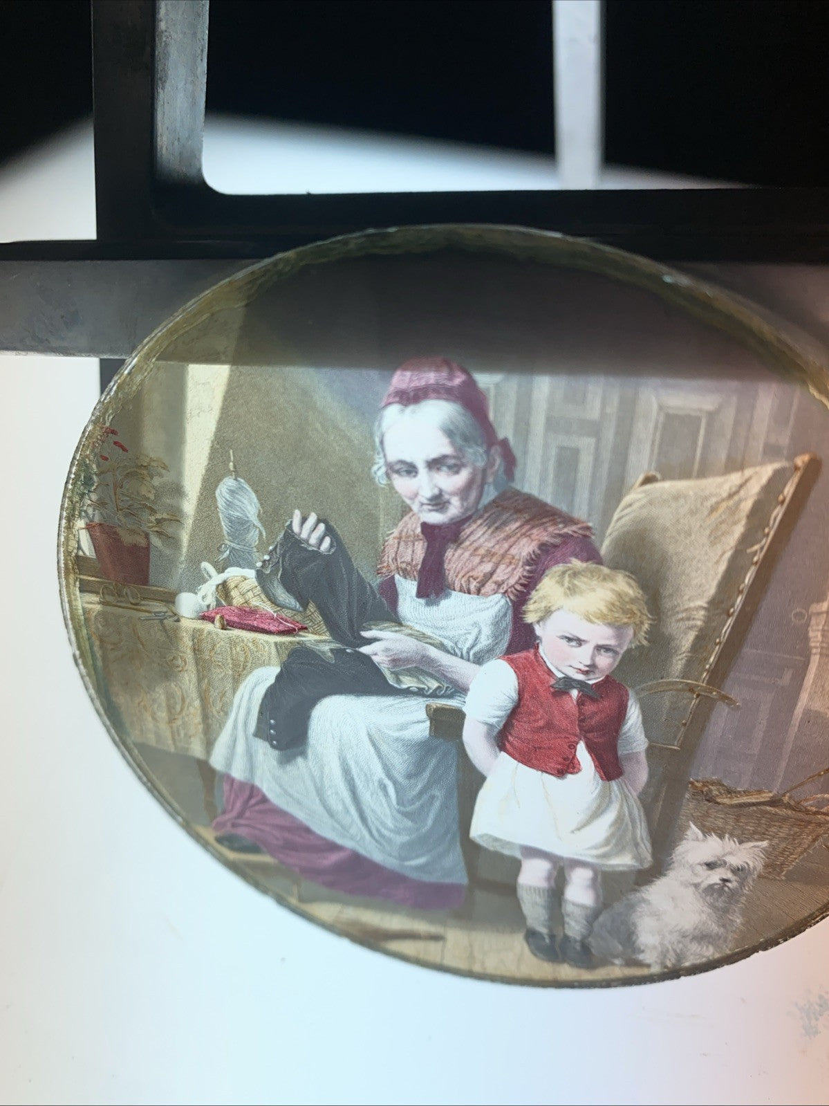 Magic Lantern Victorian Glass Round Handpainted Slide Sewing his trousers (1102)