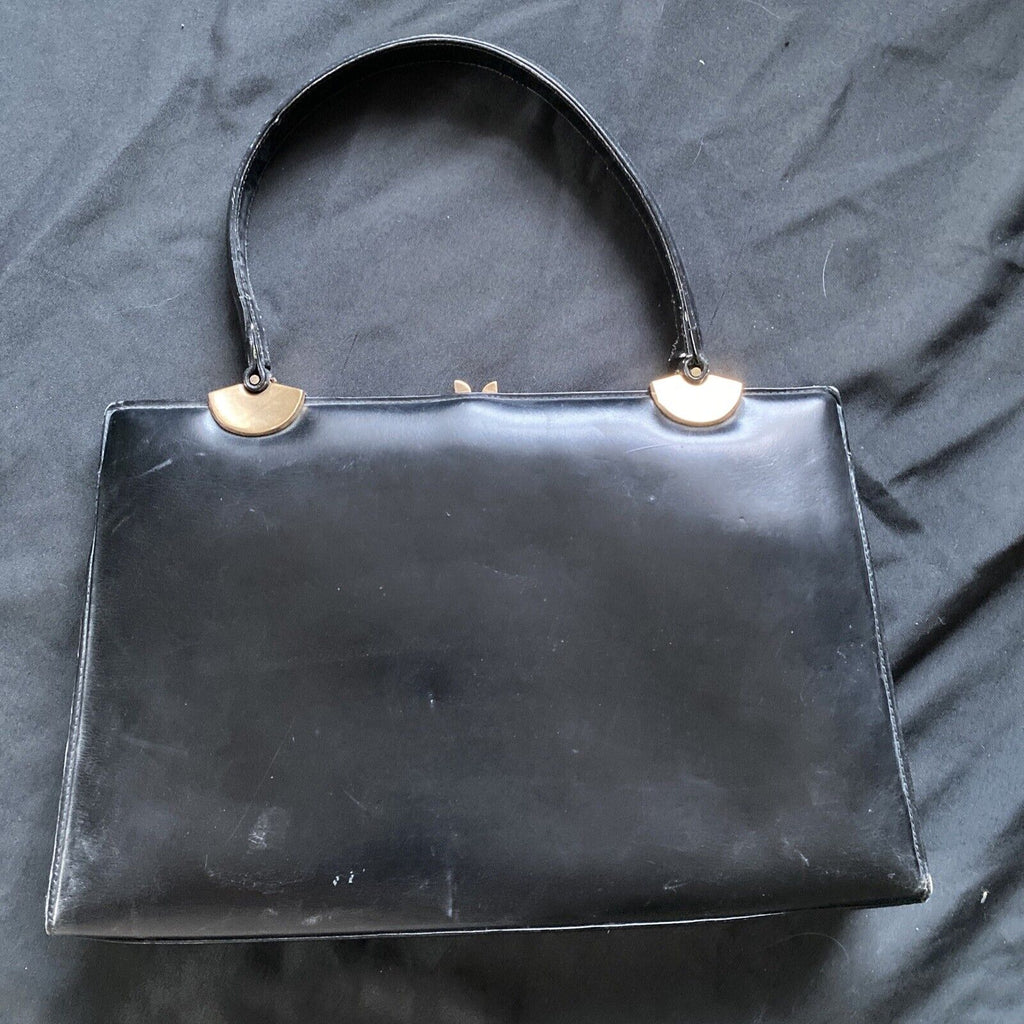 Vintage Handbag Black leather with brass fixings lined in red, heavy - (9567)