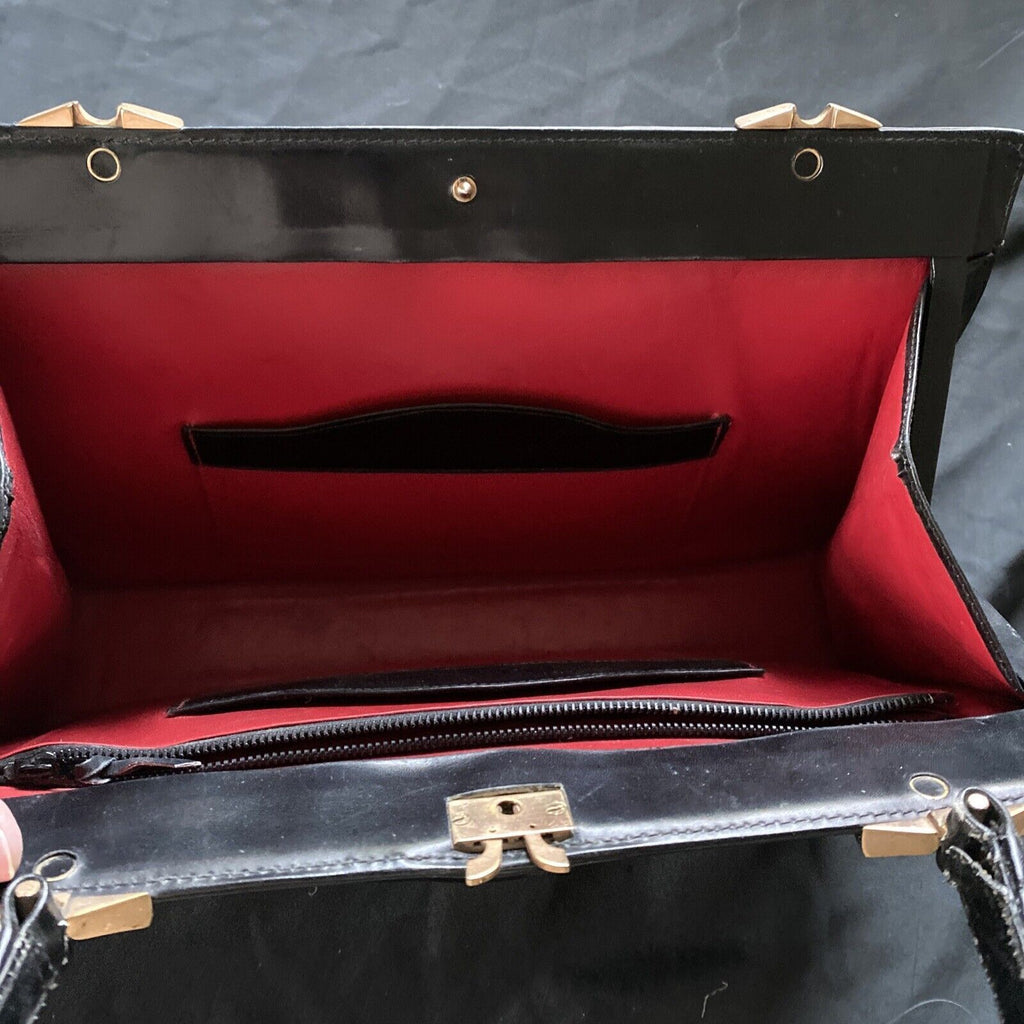 Vintage Handbag Black leather with brass fixings lined in red, heavy - (9567)