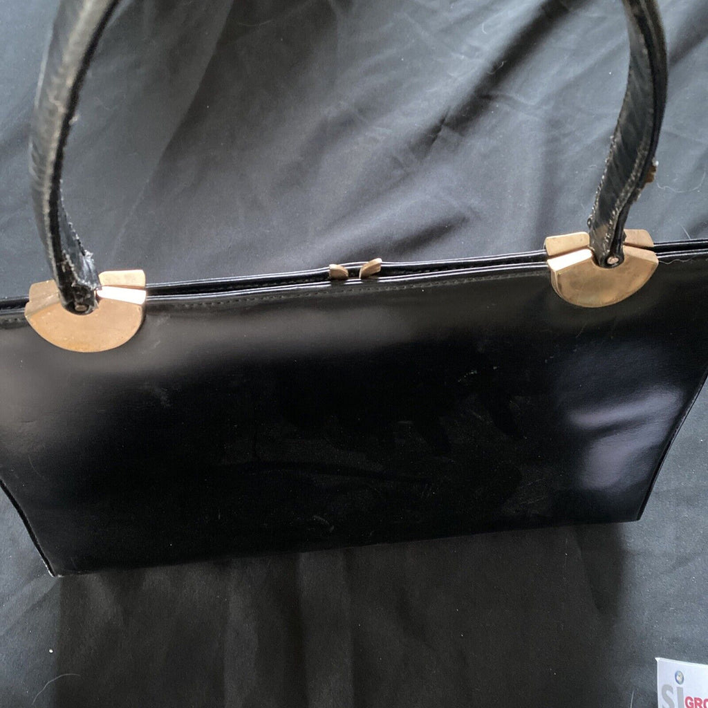 Vintage Handbag Black leather with brass fixings lined in red, heavy - (9567)