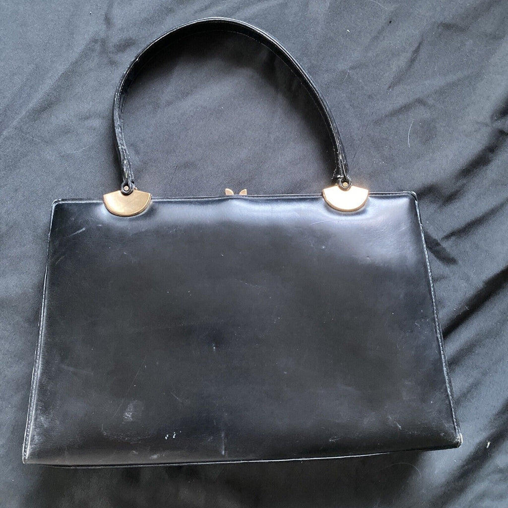 Vintage Handbag Black leather with brass fixings lined in red, heavy - (9567)