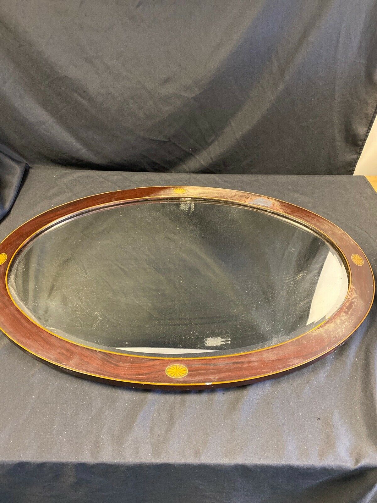 Antique oval wooden bevelled glass wall mirror (7381)