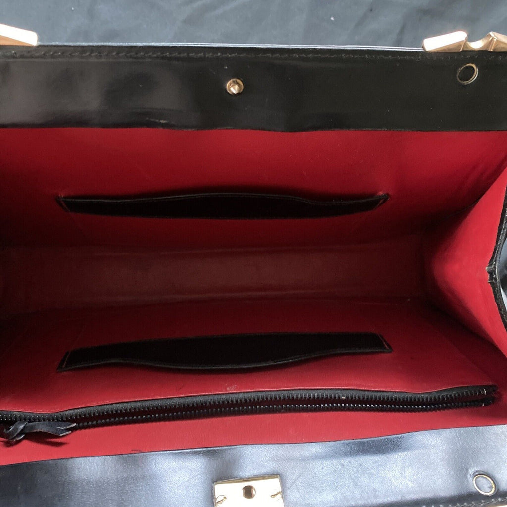 Vintage Handbag Black leather with brass fixings lined in red, heavy - (9567)