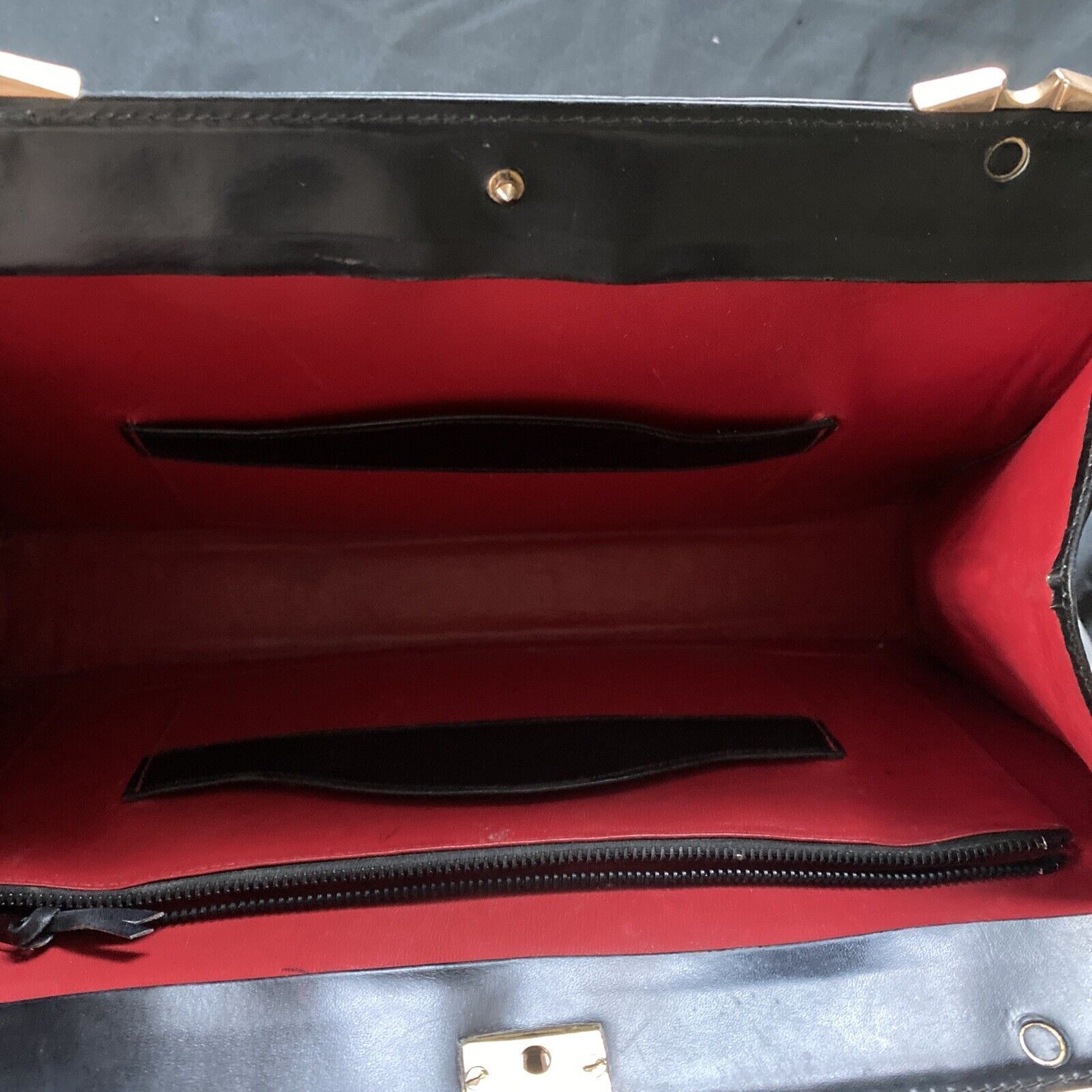 Vintage Handbag Black leather with brass fixings lined in red, heavy - (9567)